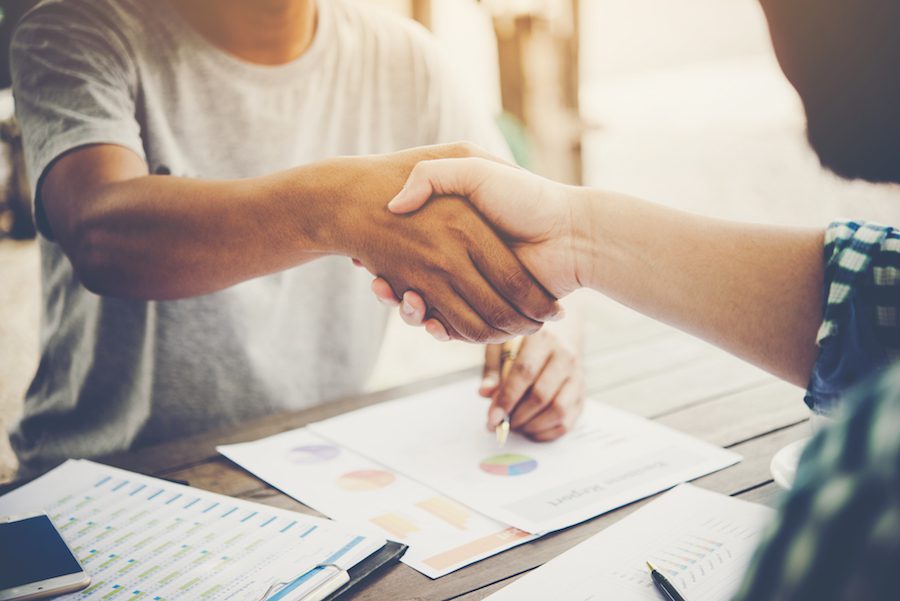 Hired at a job interview - shaking hands